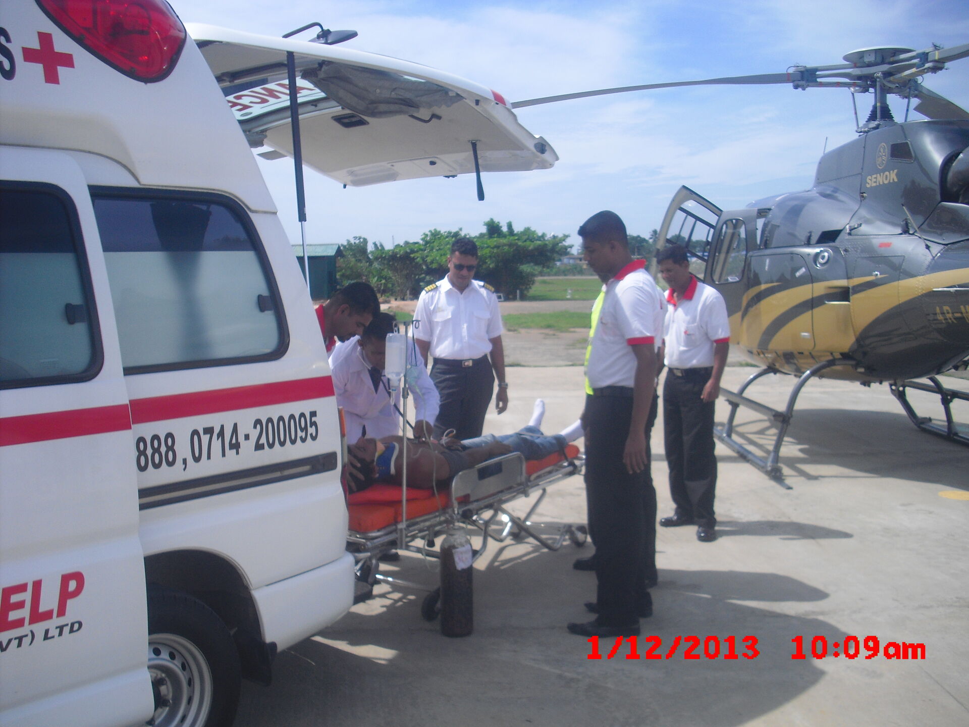 Medical team loading a patient into the aircraft