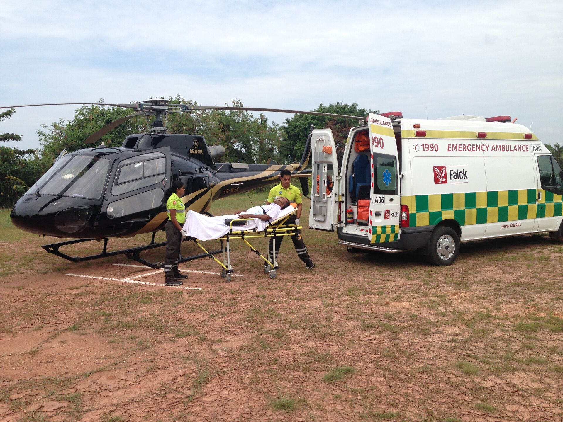 Senok Medevac coordinating a patient transfer between an ambulance and helicopter